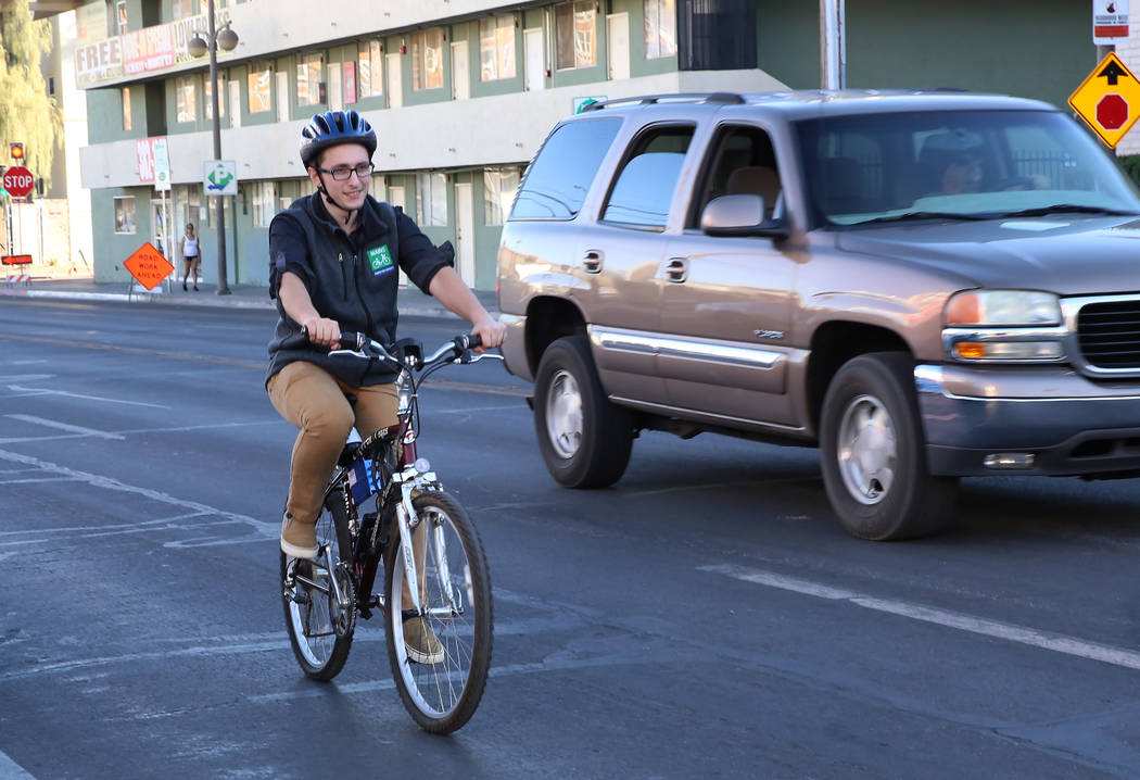Dan Duggan, software engineer at Charles River Analytics, demonstrates bicycling safety technology at the corner of Seventh Street and Carson Street on Wednesday, Dec. 13, 2017, in Las Vegas. Tech ...