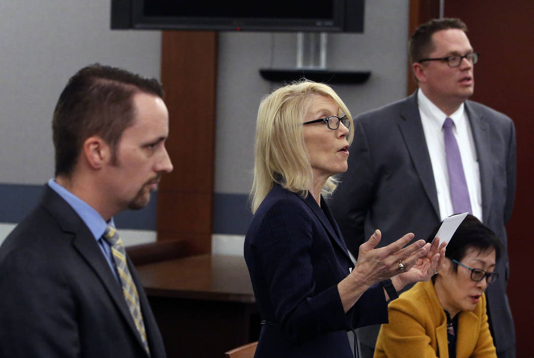 Attorneys Alice Denton, center, Thomas Grover, right, and Samuel Warren appear on Thursday, Dec. 14, 2017, at the Regional Justice Center during a hearing in the probate matter for the estate of g ...