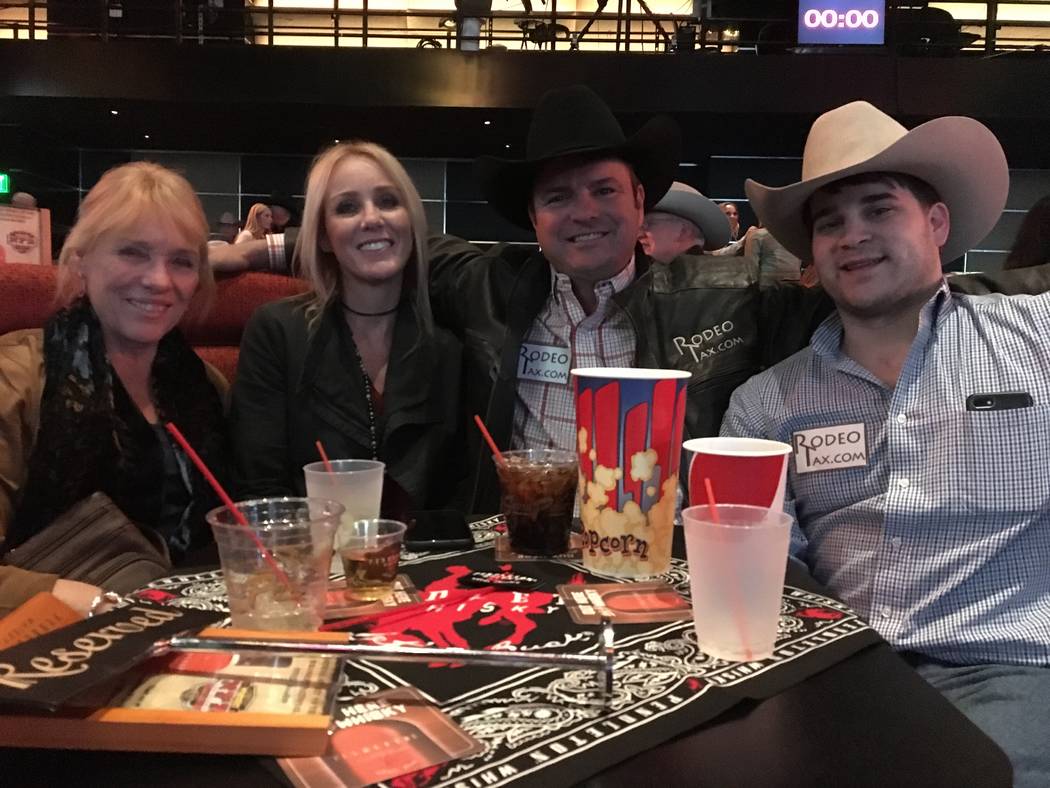 From left, Frae Wittwer, Debi Magilligan, Ernest Lee and Mark Owens parked in their reserved boot at the South Point Showroom on Tuesday night. When Lee attends the Wrangler NFR at the Thomas &amp ...