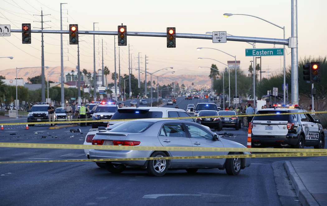 Las Vegas police in the intersection of Eastern Avenue and Flamingo Road where a multiple-vehicle crash left three people dead Wednesday, Dec. 13, 2017. Police said six people were transported to  ...