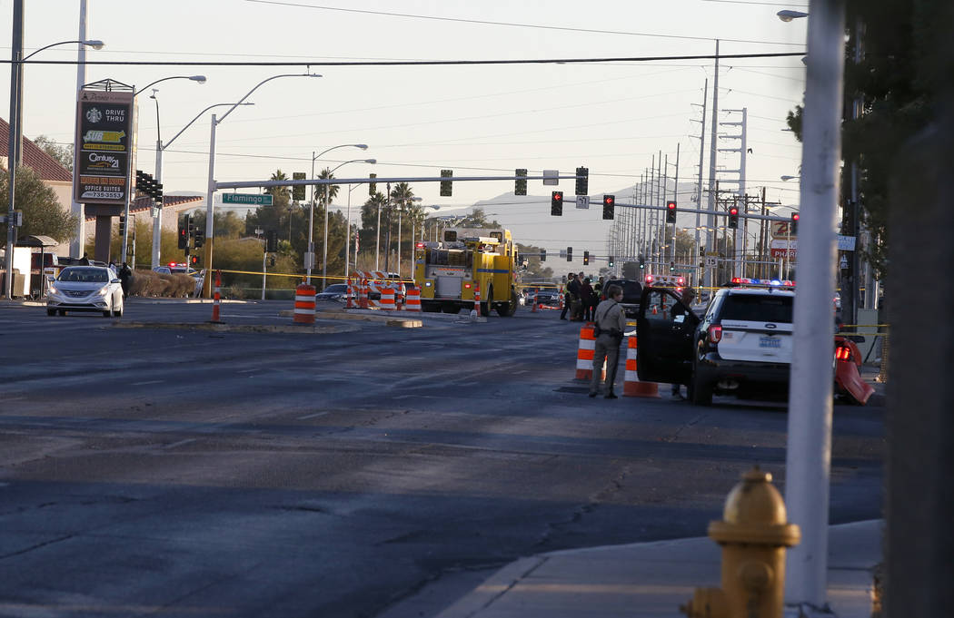 Las Vegas police in the intersection of Eastern Avenue and Flamingo Road where a multiple-vehicle crash left three children dead Wednesday, Dec. 13, 2017. Police said six people were transported t ...