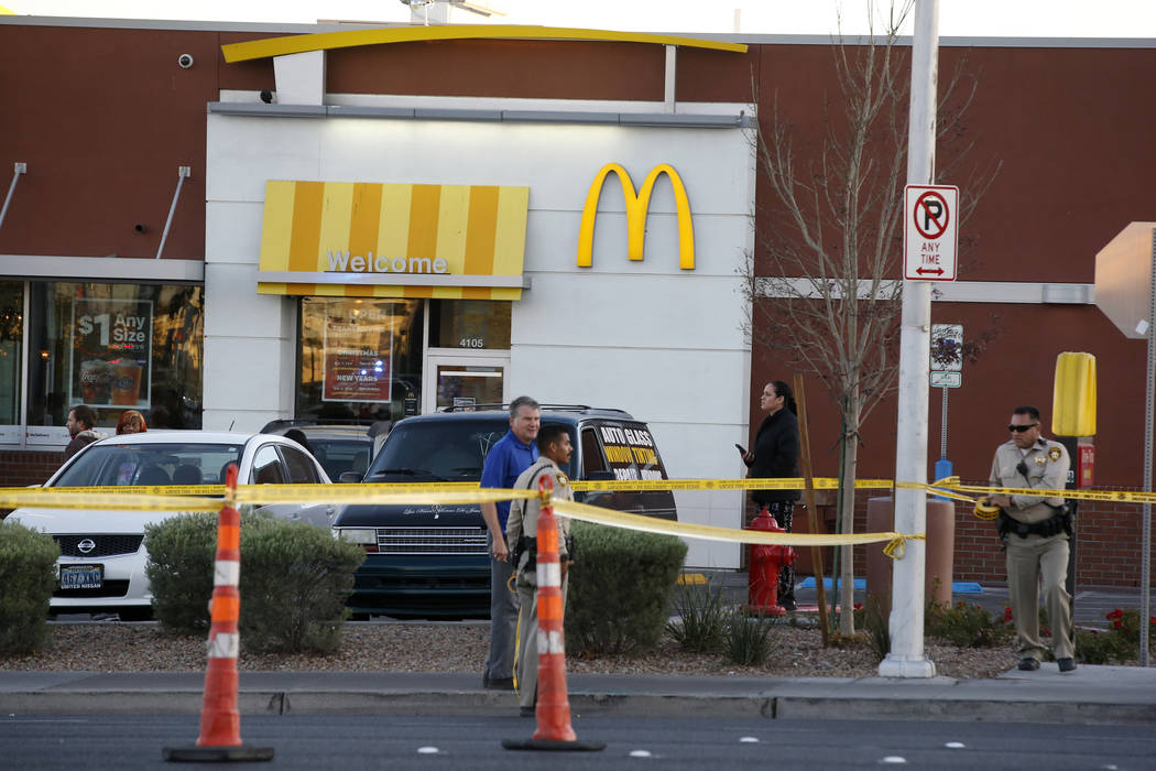 Las Vegas police sting crime scene tape near Eastern Avenue and Flamingo Road where a multiple-vehicle crash left three people dead Wednesday, Dec. 13, 2017. Police said six people were transporte ...