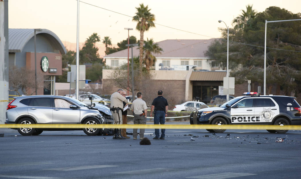 Las Vegas police in the intersection of Eastern Avenue and Flamingo Road where a multiple-vehicle crash left three people dead Wednesday, Dec. 13, 2017. Police said six people were transported to  ...