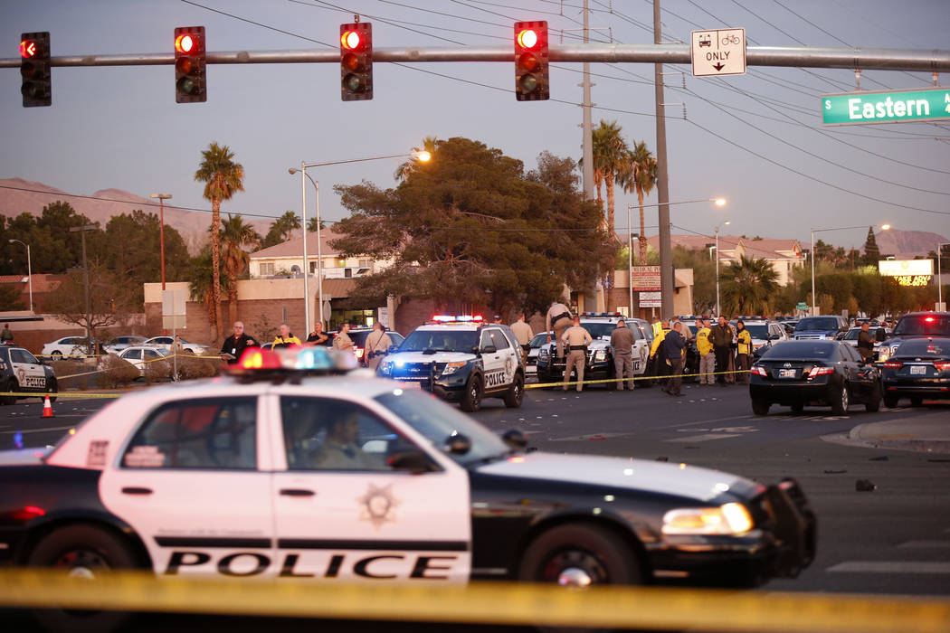 Las Vegas police in the intersection of Eastern Avenue and Flamingo Road where a multiple-vehicle crash left three people dead Wednesday, Dec. 13, 2017. Police said six people were transported to ...