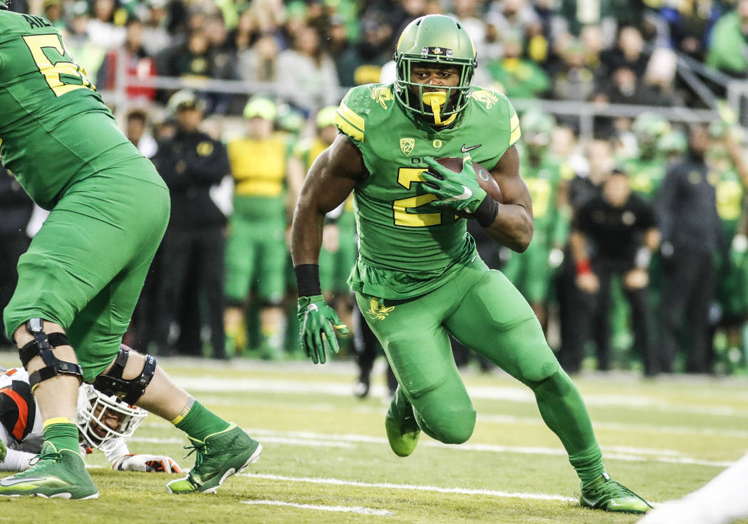 Oregon running back Royce Freeman (21), runs a first half touchdown against Oregon State in an NCAA college football game Saturday, Nov. 25, 2017 in Eugene, Ore. (AP Photo/Thomas Boyd)