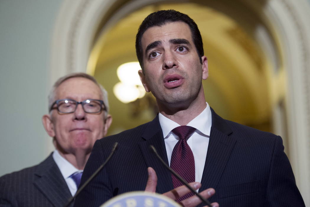 Rep.-elect Ruben Kihuen, D-Nev.,right, speaks with reporters as Sen. Harry Reid, D-Nev., left, listens on Capitol Hill in Washington, Nov. 14, 2016 . The chairman of the House Democrats' campaign  ...