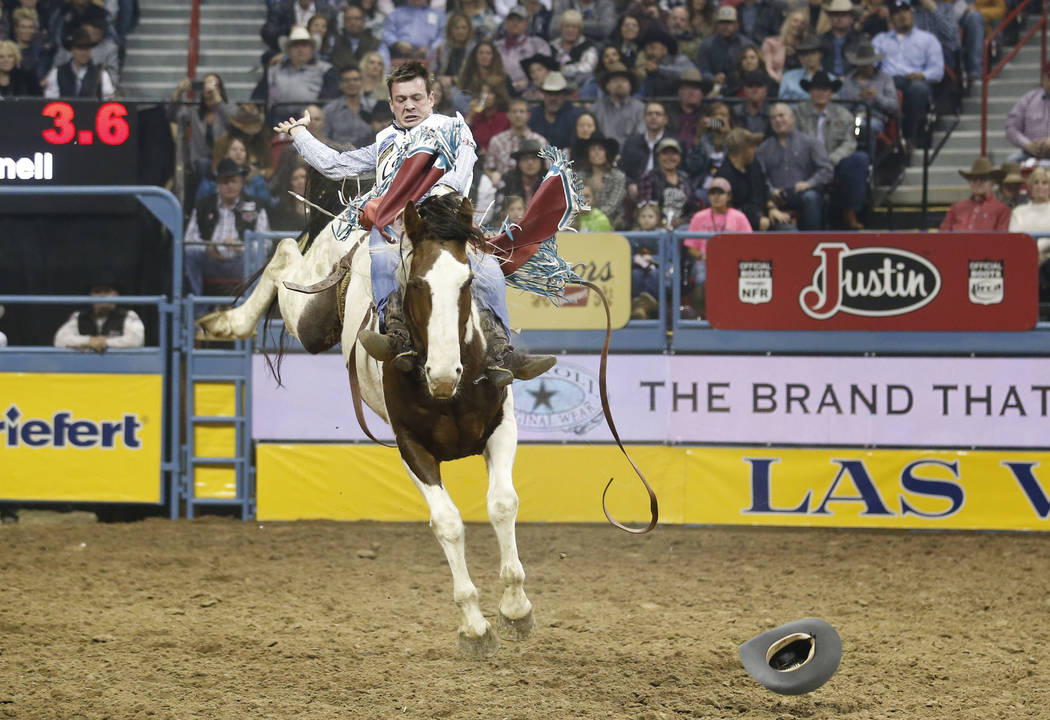 Tim O'Connell of Zwingle, Iowa rides Feather Fluffer in the bareback riding competition during the ninth go-round of the National Finals Rodeo, Friday, Dec. 15, 2017, at the Thomas & Mack Cent ...