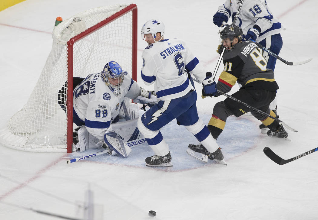 Tampa Bay goaltender Andrei Vasilevskiy (88) makes a save against Golden Knights center Jonathan Marchessault (81) in the third period during the Lightning's road matchup with Vegas on Tuesday, De ...