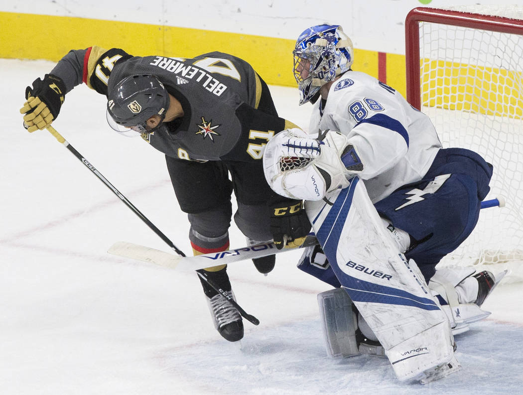 Golden Knights left wing Pierre-Edouard Bellemare (41) collides with Tampa Bay goaltender Andrei Vasilevskiy (88) in the second period during Vegas' home matchup with the Lighting on Tuesday, Dec. ...