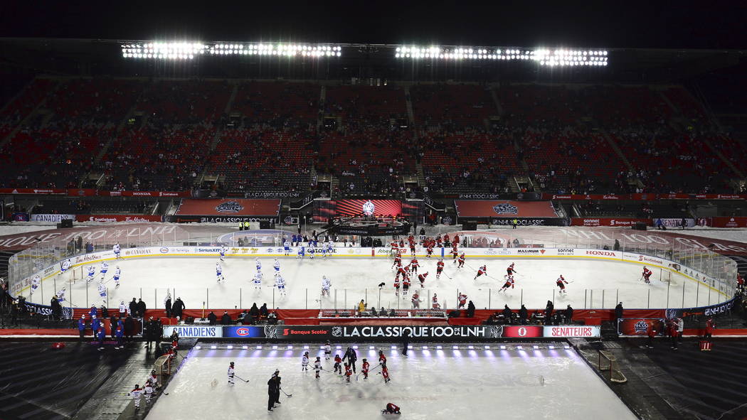Montreal Canadiens and Ottawa Senators warm up on the ice prior to action at the NHL hockey 100 Classic, in Ottawa on Saturday, Dec. 16, 2017. (Sean Kilpatrick/The Canadian Press via AP)