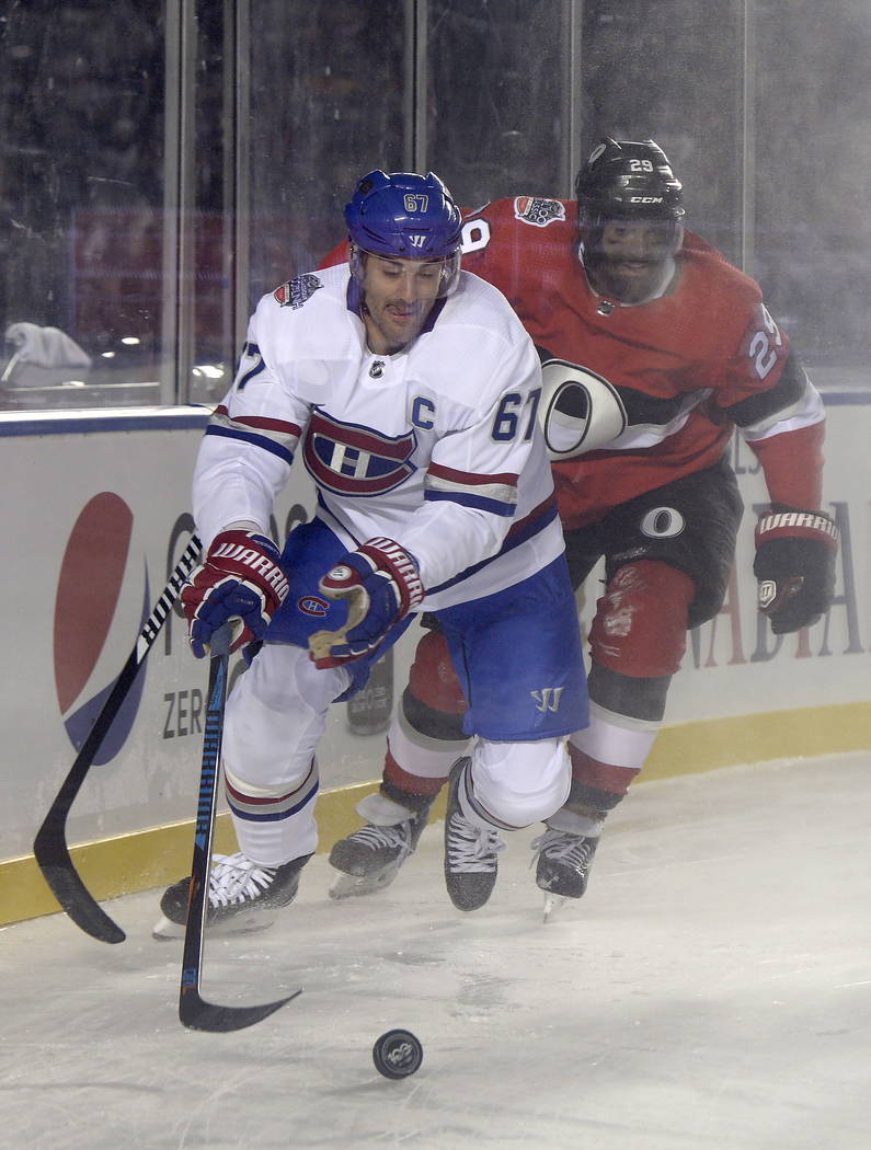 Ottawa Senators defenseman Johnny Oduya (29) gives chase as Montreal Canadiens left wing Max Pacioretty (67) goes in for the puck during first period hockey action at the NHL hockey 100 Classic in ...