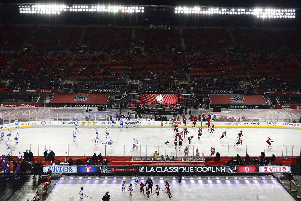 Montreal Canadiens and Ottawa Senators warm up on the ice prior to action at the NHL hockey 100 Classic, in Ottawa on Saturday, Dec. 16, 2017. (Sean Kilpatrick/The Canadian Press via AP)