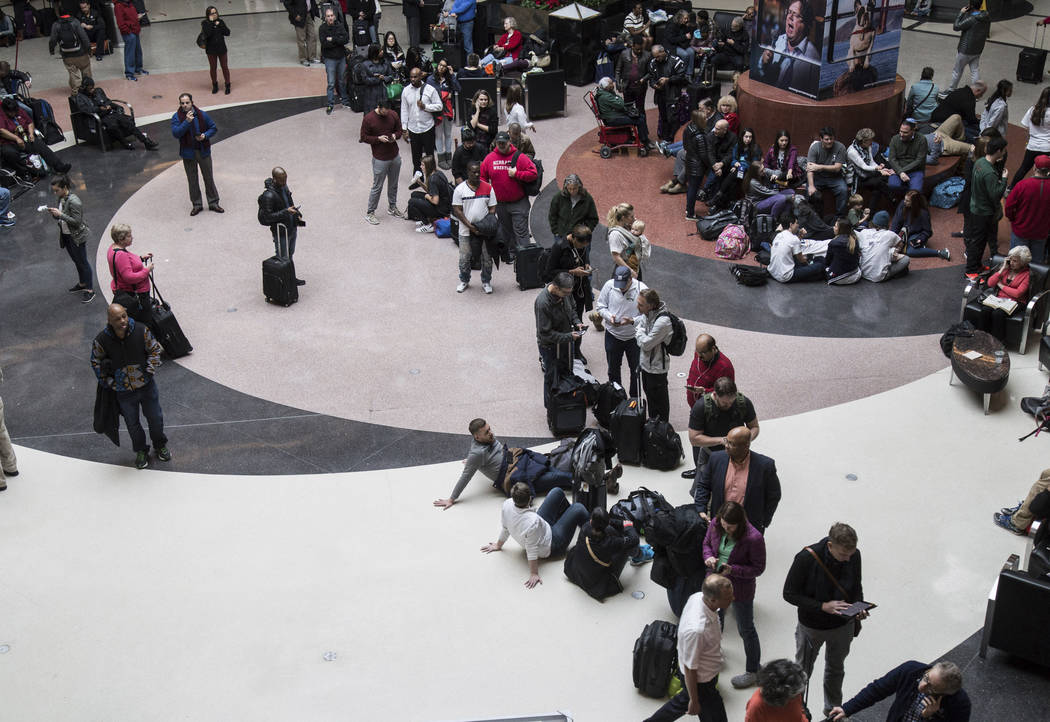 Long lines form at Hartsfield-Jackson International Airport after a power outage, Sunday, Dec. 17, 2017, in Atlanta. A sudden power outage at the Hartsfield-Jackson Atlanta International Airport o ...