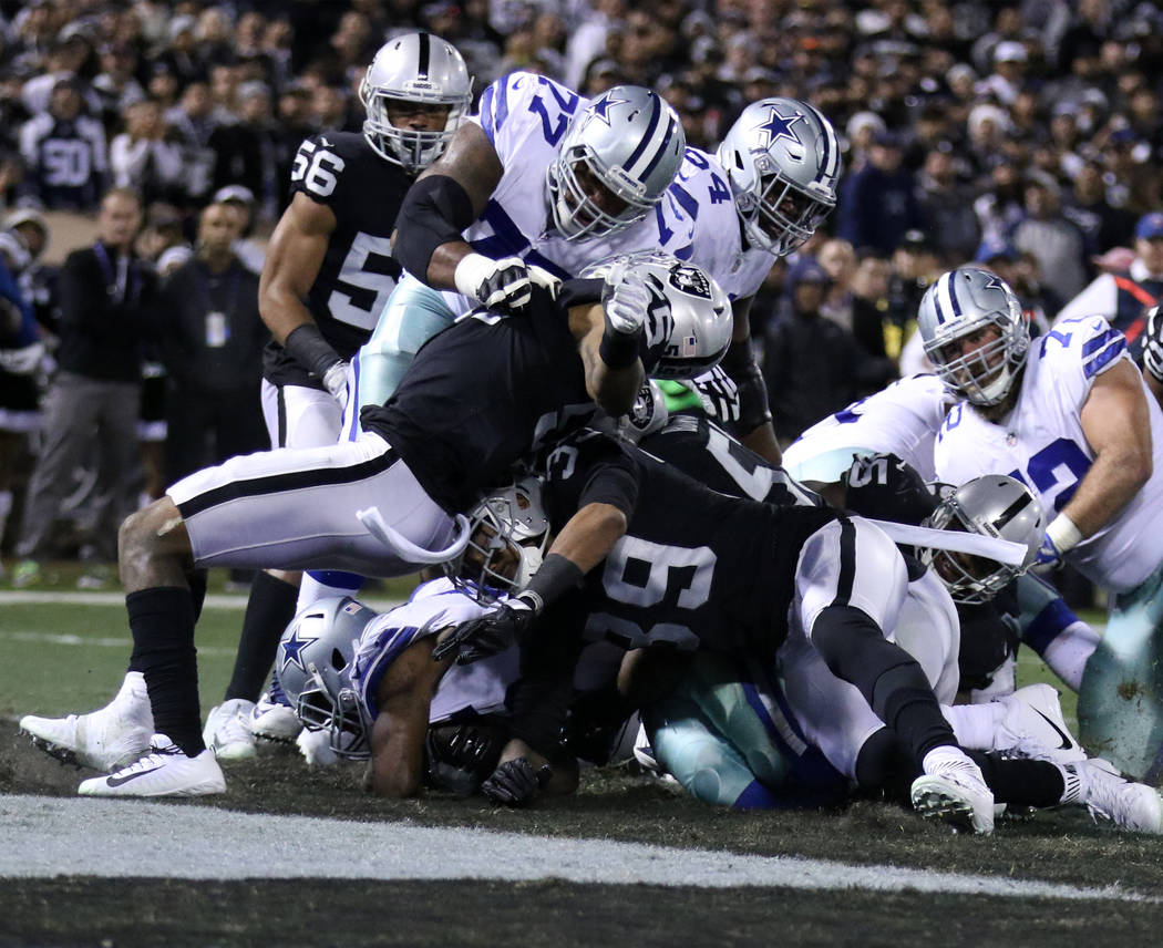 Dallas Cowboys running back Rod Smith (45) scores a 1-yard rushing touchdown against the Oakland Raiders during the first half of a NFL game in Oakland, Calif., Sunday, Dec. 17, 2017. Heidi Fang L ...