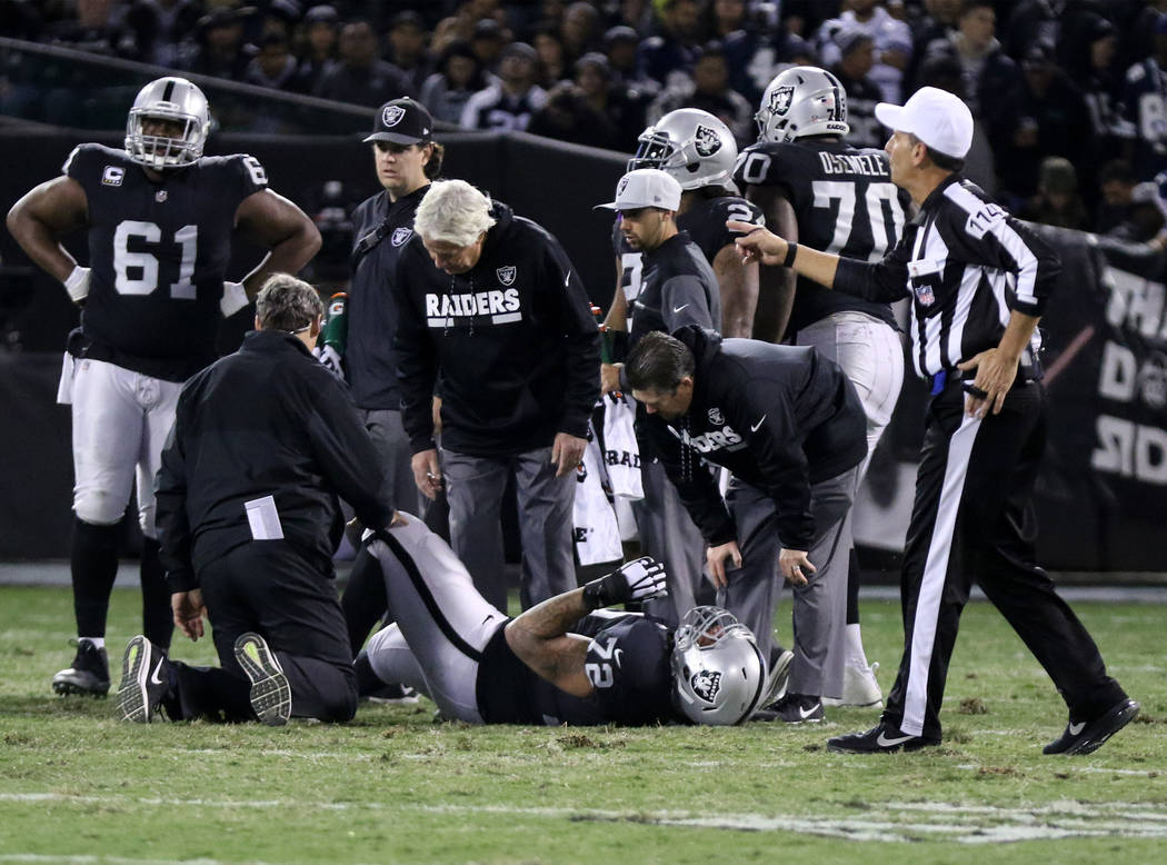 Oakland Raiders offensive tackle Donald Penn (72) is looked at by trainers after being hurt during the first half of a NFL game in Oakland, Calif., Sunday, Dec. 17, 2017. Heidi Fang Las Vegas Revi ...