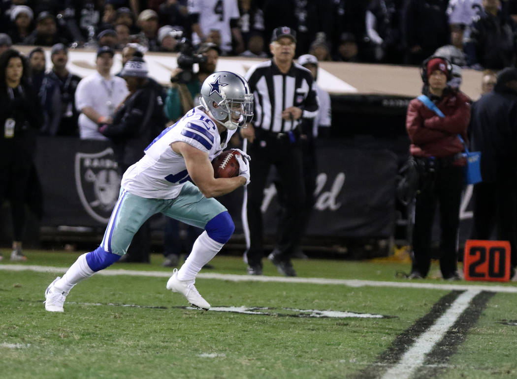 Dallas Cowboys wide receiver Ryan Switzer (10) runs with the ball on a punt return against the Oakland Raiders during the first half of a NFL game in Oakland, Calif., Sunday, Dec. 17, 2017. Heidi  ...