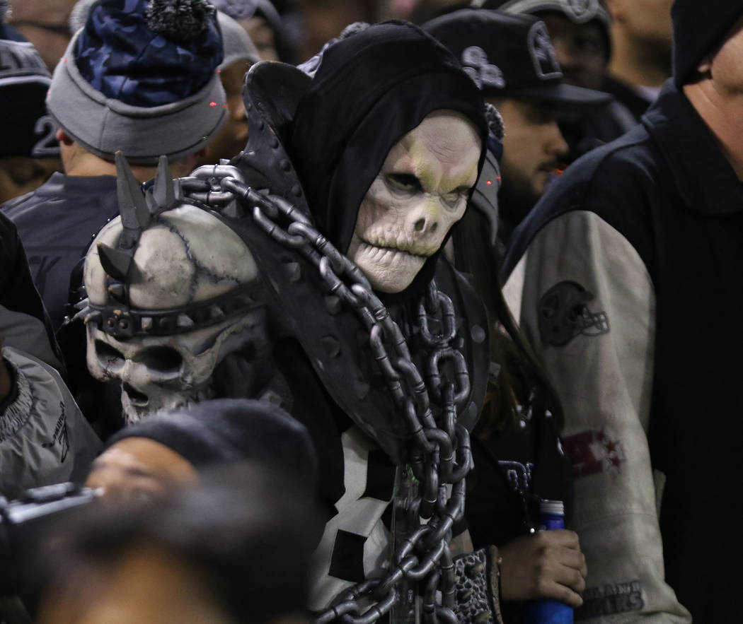 An Oakland Raiders fan watches the team play the Dallas Cowboys during the first half of a NFL game in Oakland, Calif., Sunday, Dec. 17, 2017. Heidi Fang Las Vegas Review-Journal @HeidiFang