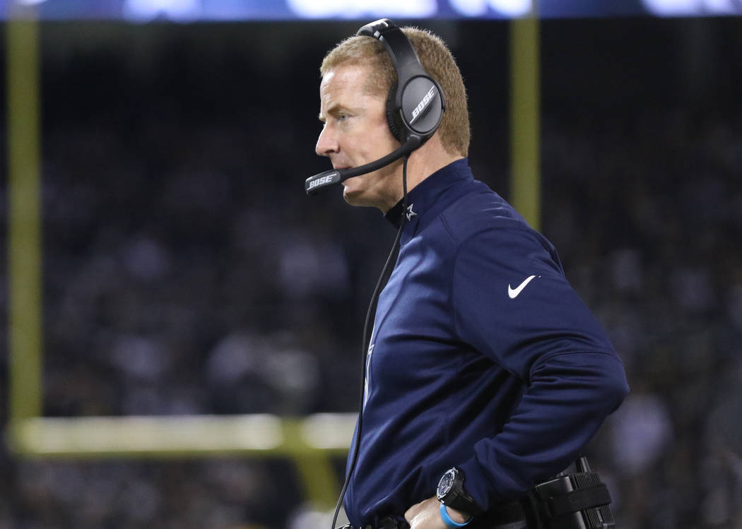 Dallas Cowboys head coach Jason Garrett coaches on the sideline during the first half of a NFL game against the Oakland Raiders in Oakland, Calif., Sunday, Dec. 17, 2017. Heidi Fang Las Vegas Revi ...