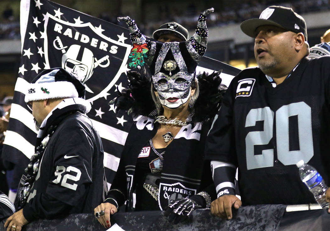 An Oakland Raiders fan with a holiday themed mask during the first half of a NFL game against the Dallas Cowboys in Oakland, Calif., Sunday, Dec. 17, 2017. Heidi Fang Las Vegas Review-Journal @Hei ...