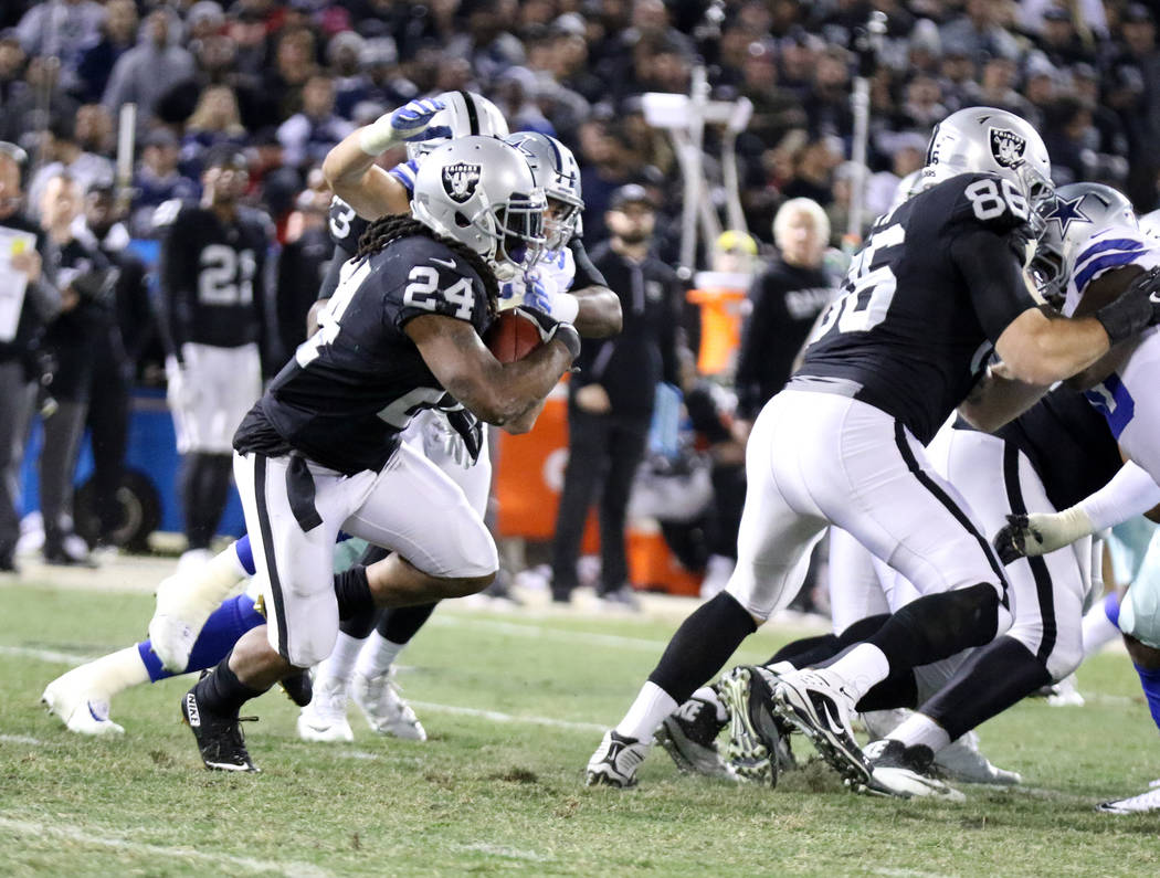 Oakland Raiders running back Marshawn Lynch (24) runs with the football against the Dallas Cowboys during the first half of a NFL game in Oakland, Calif., Sunday, Dec. 17, 2017. Heidi Fang Las Veg ...