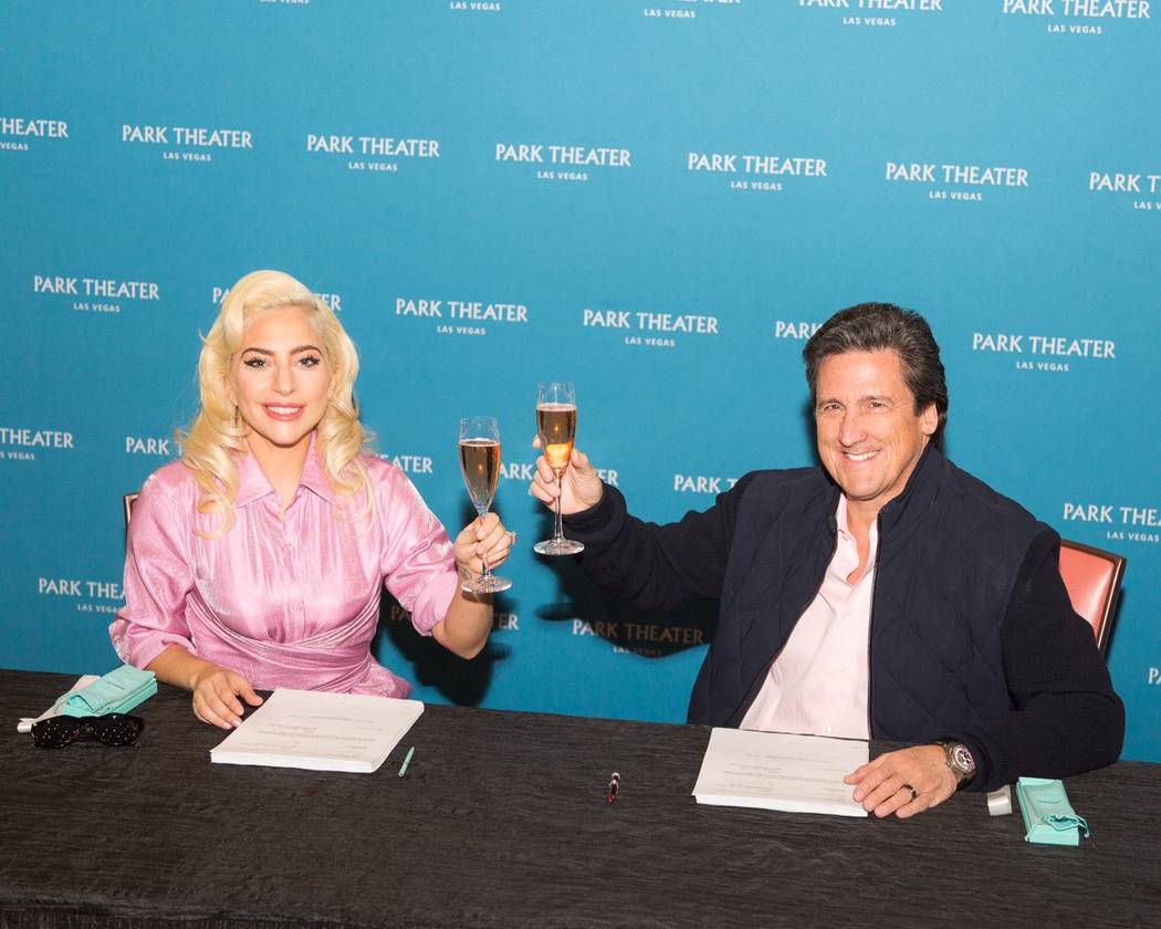 Lady Gaga is shown with MGM Resorts International President Bill Hornbuckle after signing her two-year, multishow contract to perform at The Park Theater on Wednesday, Dec. 19, 2017. (Alex Dolan)