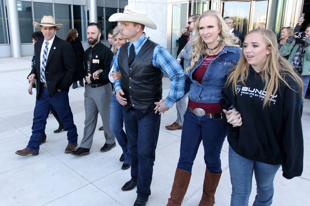 Carol Bundy, from left, Ammon Bundy, Ryan Payne, Jeanette Finicum, Ryan Bundy, his wife, Angie, and his daughter, Jamie, walk out of the Lloyd George U.S. Courthouse on Wednesday, Dec. 20, 2017, a ...