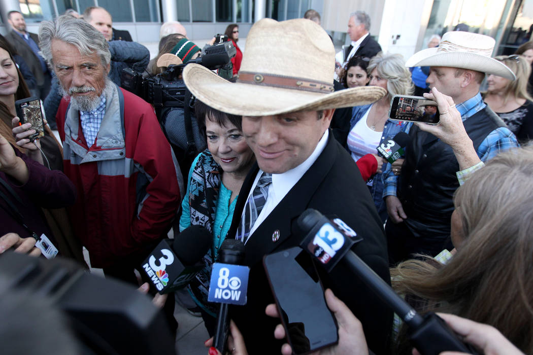 Defendant Ammon Bundy and his mother, Carol Bundy, talk to the news media outside the Lloyd George U.S. Courthouse on Wednesday, Dec. 20, 2017, after a mistrial was declared in the Bunkerville sta ...