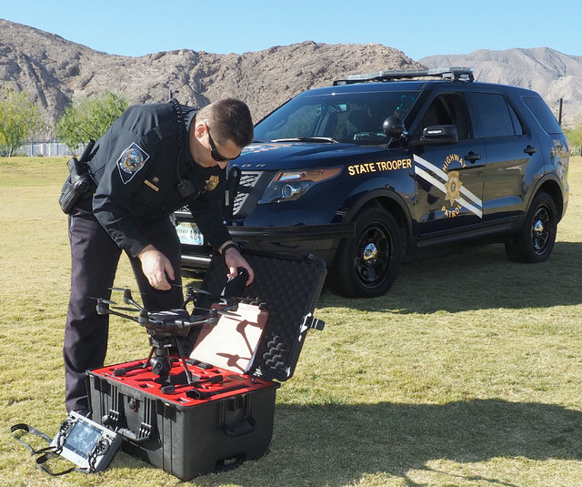 Nevada Highway Patrol Trooper Daniel Marek unpacks a Yuneec Typhoon H unmanned aerial vehicle during a news conference at Lone Mountain Regional Park in Las Vegas, Friday, Oct. 21, 2016. Jerry Hen ...