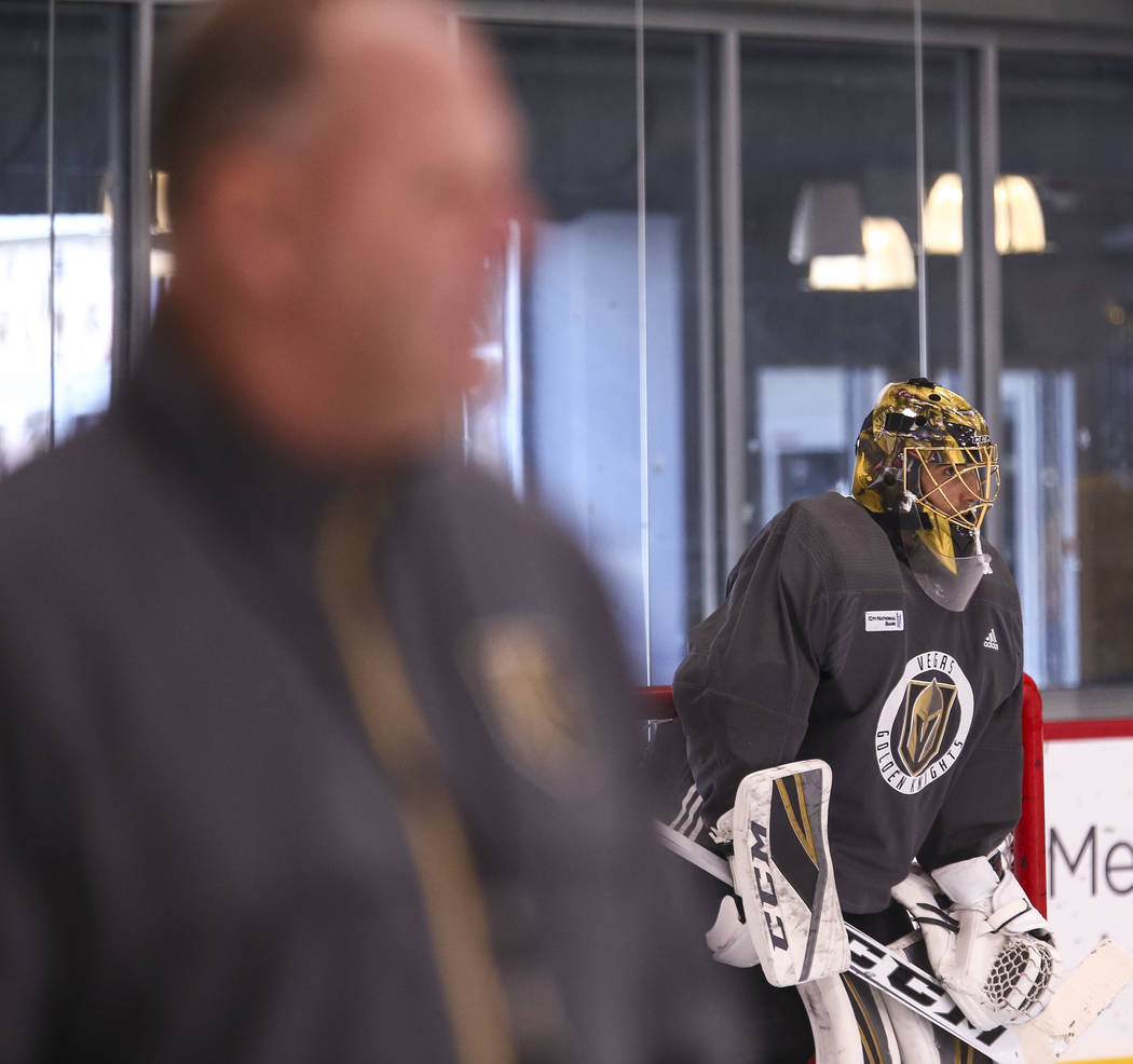 Vegas Golden Knights coach Gerard Gallant, left, and goalie Marc-Andre Fleury on the ice during the NHL team's practice at the City National Arena in Las Vegas, Wednesday, Dec. 6, 2017. Richard Br ...