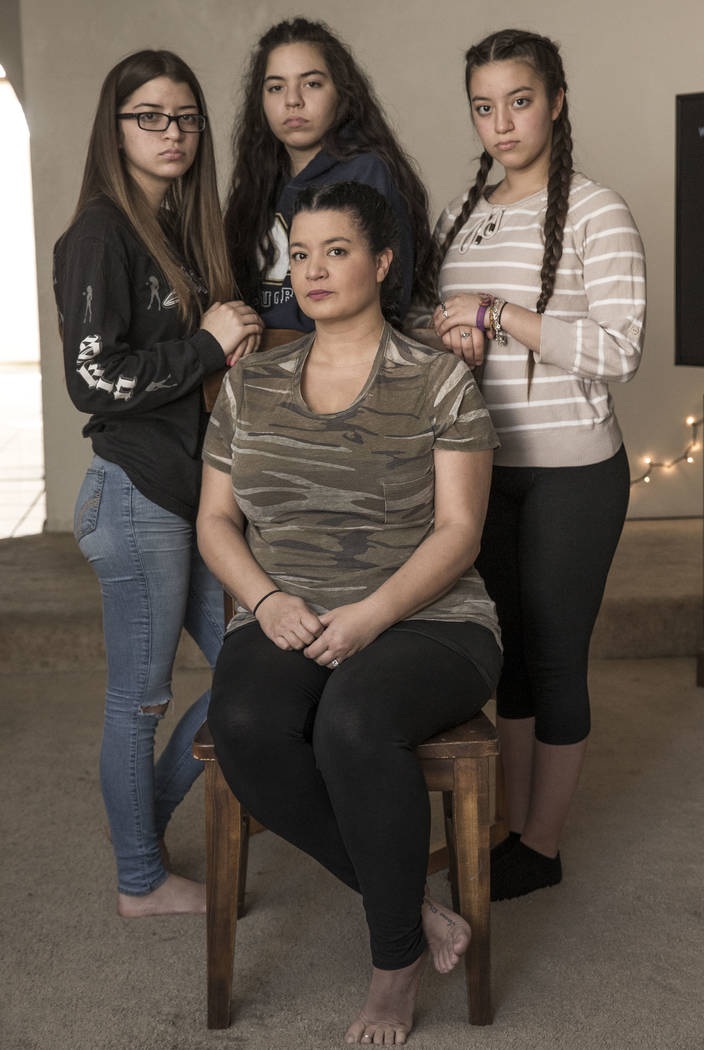 Route 91 survivors Sumer Henning, sitting, and her daughters, from left, Isabella, 15, Jacquelyn, 18, and Francesca, 13, at their Las Vegas home on Friday, Dec. 22, 2017. Richard Brian Las Vegas R ...