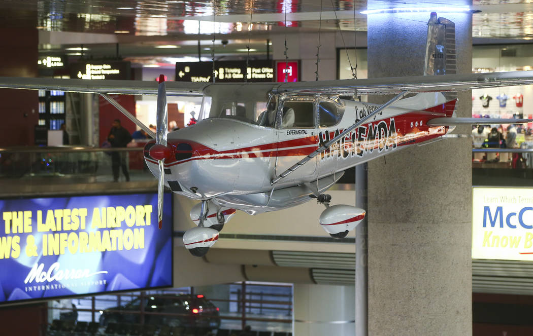 A 1958 Cessna 172 single-engine plane, part of the Howard W. Cannon Aviation Museum, hangs over the baggage claim at McCarran International Airport in Las Vegas on Tuesday, Dec. 26, 2017. Chase St ...