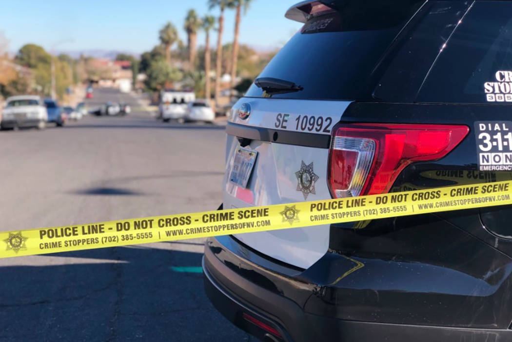 Las Vegas police investigate after two people were found dead Dec. 22 inside an eastern valley home. (Rio Lacanlale/Las Vegas Review-Journal)