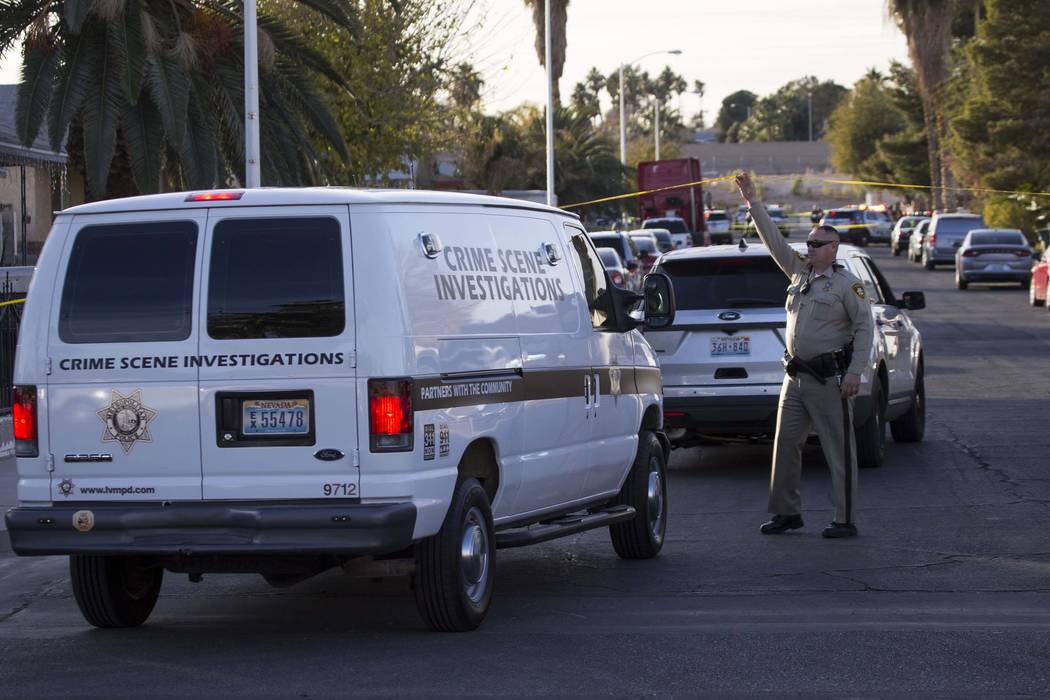 Crime scene investigators arrive at the scene of a triple homicide at the 4300 block of Del Santos Drive in east Las Vegas on Friday, Dec. 22, 2017. (Richard Brian/Las Vegas Review-Journal) @vegas ...