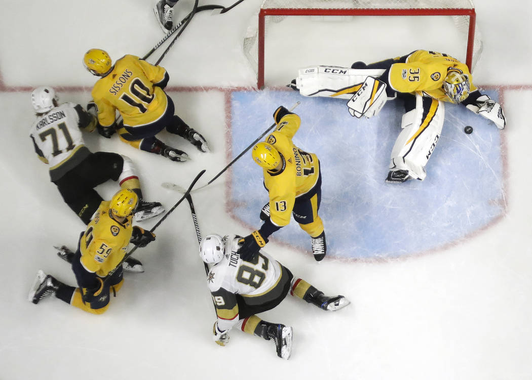 Nashville Predators goalie Pekka Rinne (35), of Finland, blocks a shot by the Vegas Golden Knights during the second period of an NHL hockey game Friday, Dec. 8, 2017, in Nashville, Tenn. (AP Phot ...