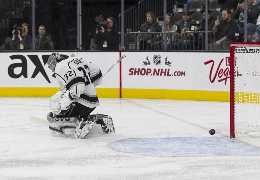 A goal from Vegas Golden Knights center William Karlsson gets past Los Angeles Kings goalie Jonathan Quick (32) during the first period of an NHL hockey game at the T-Mobile Arena in Las Vegas on ...