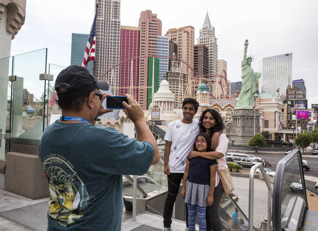 Ashish Mehta takes a photo of his wife Ami and children Arnav, 14, and Veda, 7, on the Las Vegas Strip on Monday, July 17, 2017. The family was visiting from Illinois.  Patrick Connolly Las Vegas  ...