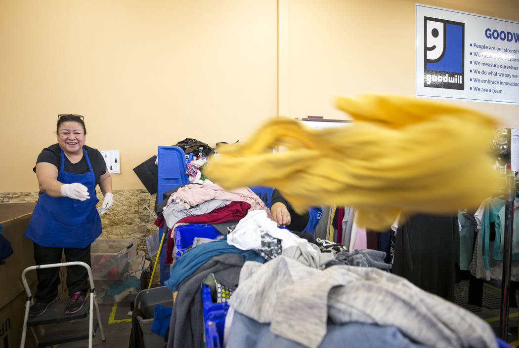 Associate processor Nora Romero sorts though clothing donations at the Goodwill store located at 1390 American Pacific Drive in Henderson on Thursday, Dec. 28, 2017. Richard Brian Las Vegas Review ...