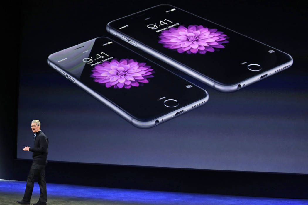 Apple CEO Tim Cook talks about the iPhone 6 and iPhone 6 Plus during an Apple event in San Francisco on March 9, 2015. (Eric Risberg/AP, File)