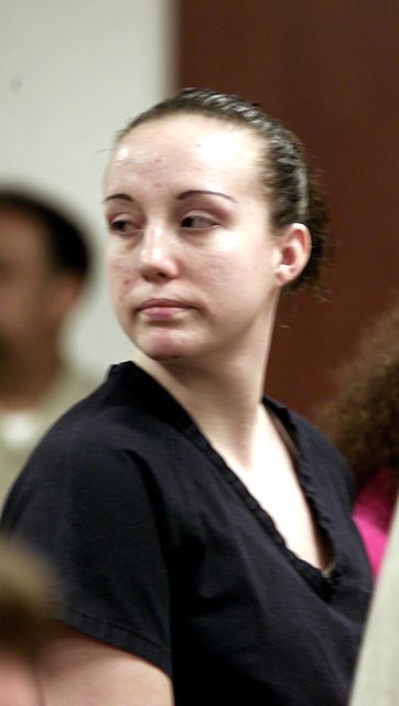 Kirstin Lobato, then 19, turns toward her family after being sentenced Aug. 28, 2002, to at least 40 years in prison for killing and sexually mutilating a homeless man. Las Vegas Review-Journal fi ...