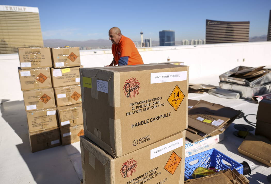 Fireworks by Grucci pyrotechnician Anthony Magno Sr. unpacks boxes of fireworks in preparation for the New Year's Eve fireworks show from the rooftop of Treasure Island on the Vegas Strip on Frida ...