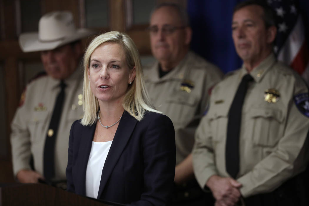 Secretary of Homeland Security Kirstjen Nielsen stands with a group of Texas sheriffs during a news conference to address sanctuary cities Tuesday, Dec. 12, 2017, in Austin, Texas. (AP Photo/Eric Gay)