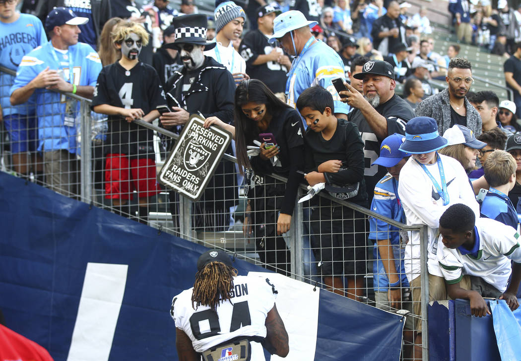 Oakland Raiders wide receiver Cordarrelle Patterson (84) signs items at halftime during an NFL game against the Los Angeles Chargers at StubHub Center in Carson, Calif. on Sunday, Dec. 31, 2017. C ...