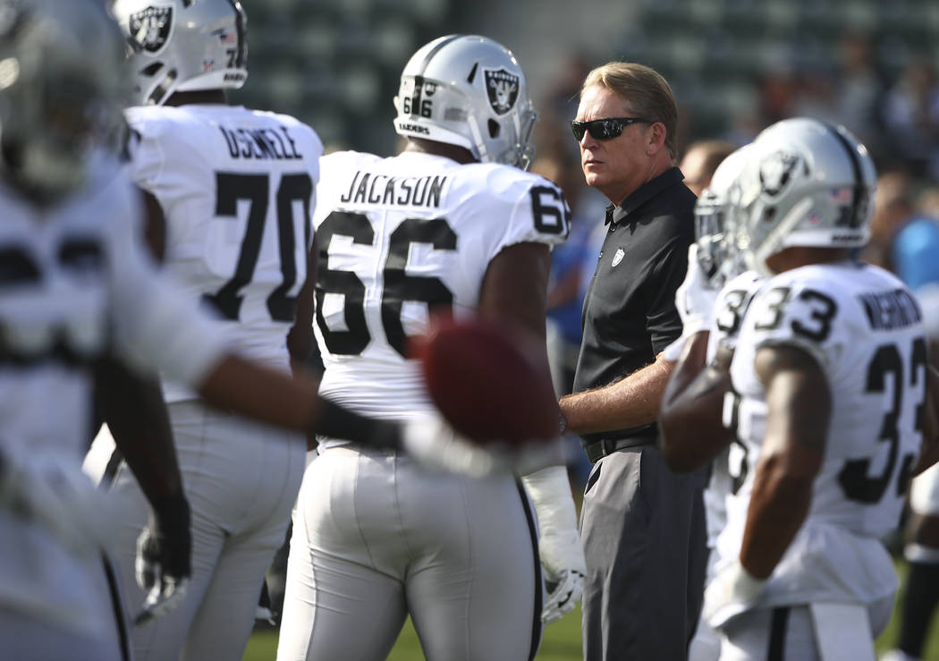 Oakland Raiders head coach Jack Del Rio watches as his team warms up before playing the Los Angeles Chargers during an NFL game at StubHub Center in Carson, Calif. on Sunday, Dec. 31, 2017. (Chase ...