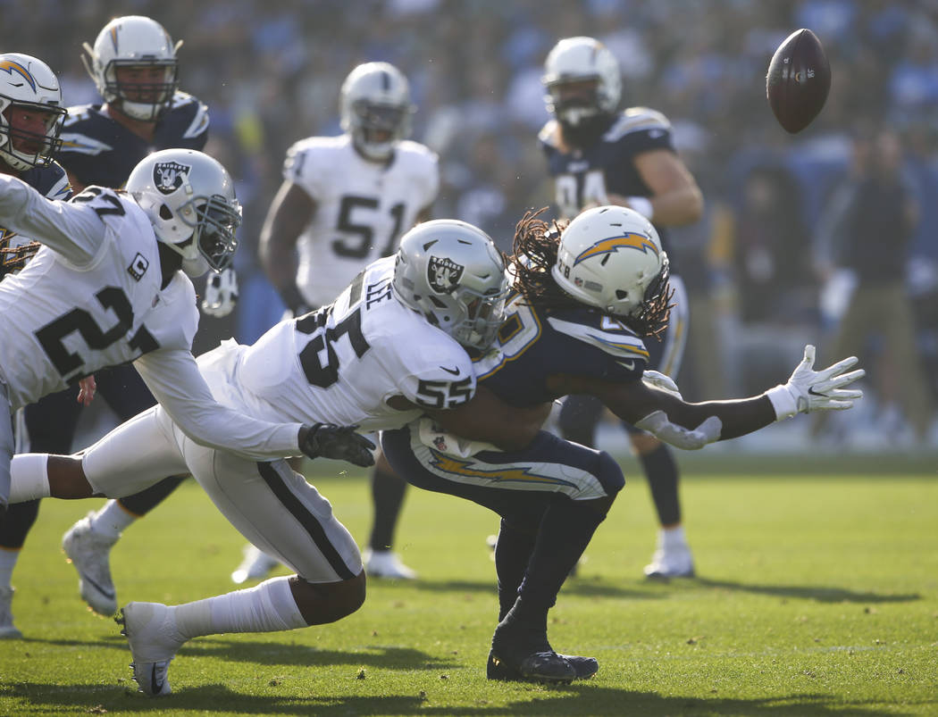 Oakland Raiders middle linebacker Marquel Lee (55) forces Los Angeles Chargers running back Melvin Gordon (28) to fumble during an NFL game at StubHub Center in Carson, Calif. on Sunday, Dec. 31,  ...