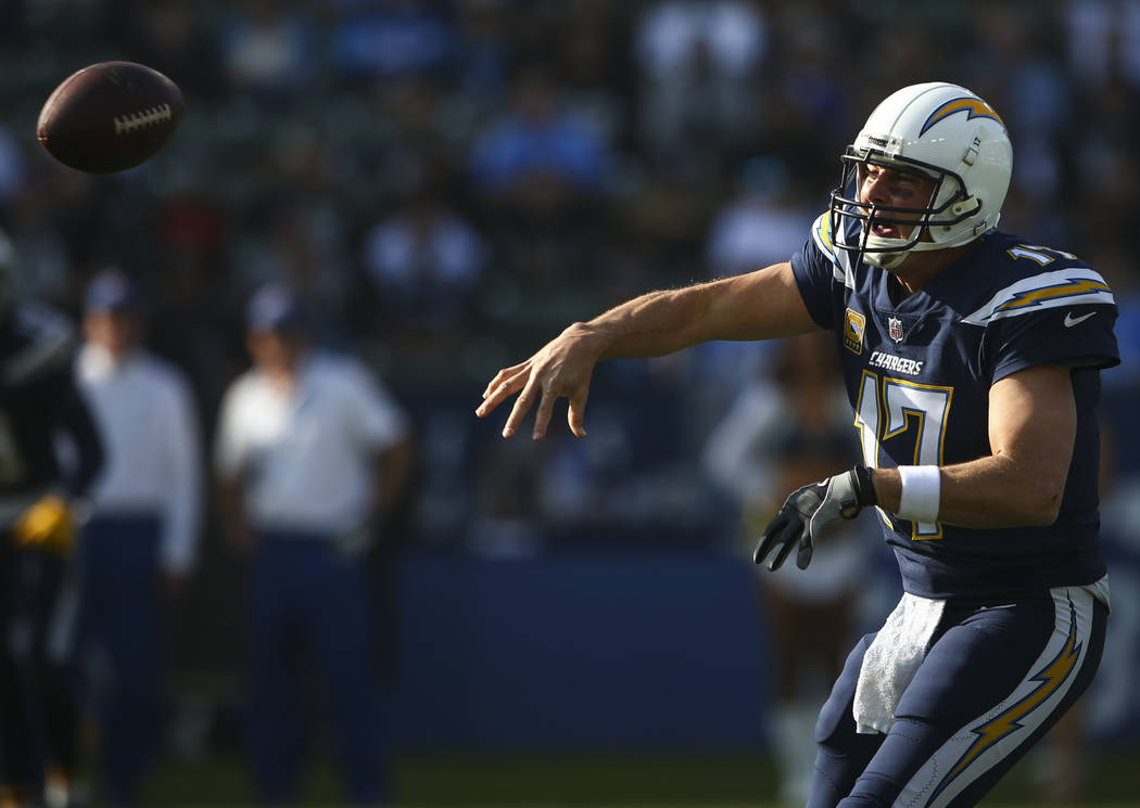 Los Angeles Chargers quarterback Philip Rivers (17) passes the ball during an NFL game against the Oakland Raiders at StubHub Center in Carson, Calif. on Sunday, Dec. 31, 2017. Chase Stevens Las V ...