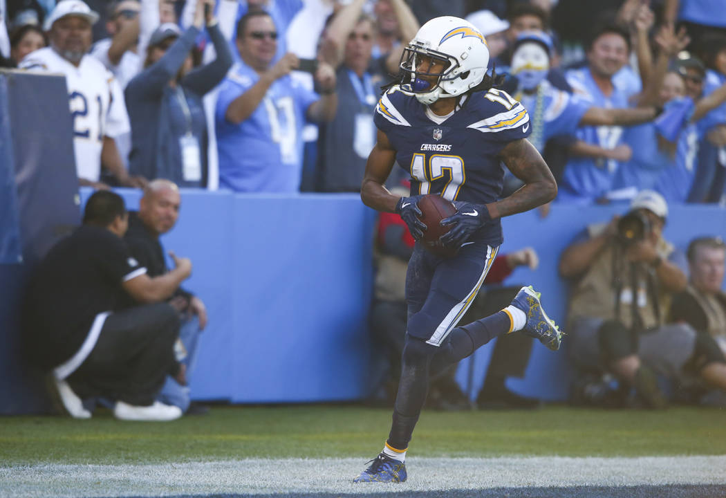 Los Angeles Chargers wide receiver Travis Benjamin (12) scores a touchdown against the Oakland Raiders during an NFL game at StubHub Center in Carson, Calif. on Sunday, Dec. 31, 2017. Chase Steven ...
