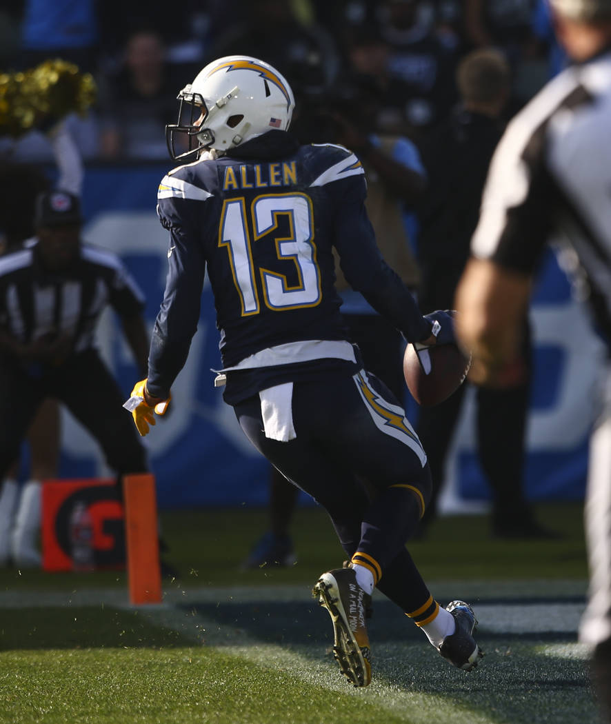 Los Angeles Chargers wide receiver Keenan Allen (13) scores a touchdown against the Oakland Raiders during an NFL game at StubHub Center in Carson, Calif. on Sunday, Dec. 31, 2017. Chase Stevens L ...