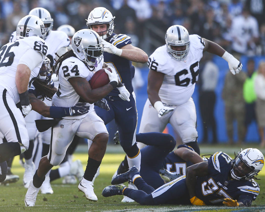 Oakland Raiders running back Marshawn Lynch (24) runs the ball against the Los Angeles Chargers during an NFL game at StubHub Center in Carson, Calif. on Sunday, Dec. 31, 2017. Chase Stevens Las V ...