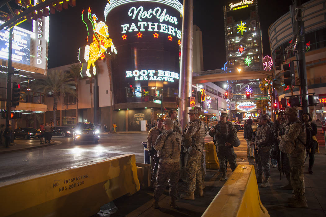 Members of the National Guard stand watch for New Year's Eve crowds in downtown Las Vegas, Sunday, Dec. 31, 2017. Rachel Aston Las Vegas Review-Journal @rookie__rae