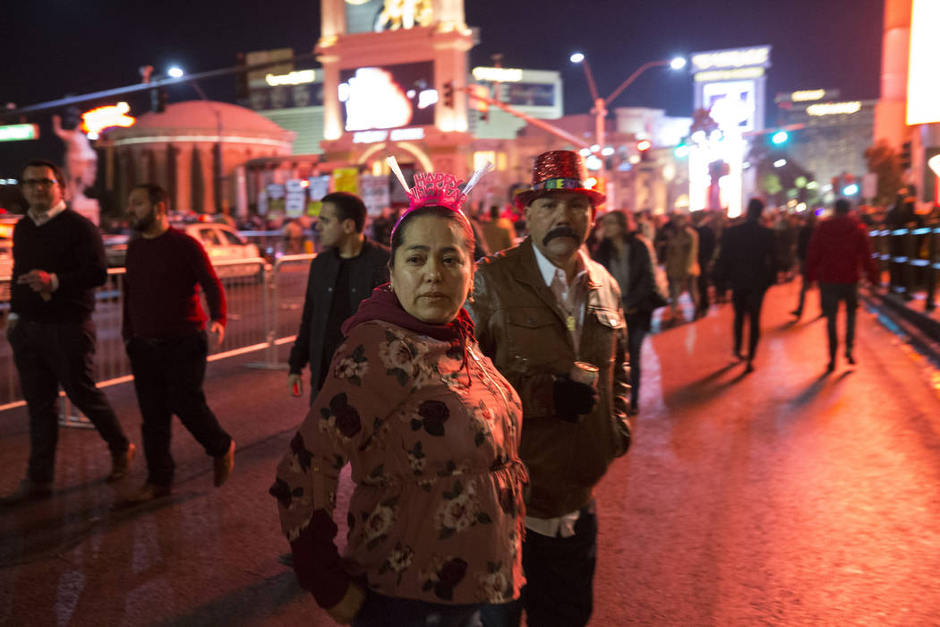 People walk on the Strip on New Year's Eve, Sunday, Dec. 31, 2017. Richard Brian Las Vegas Review-Journal @vegasphotograph